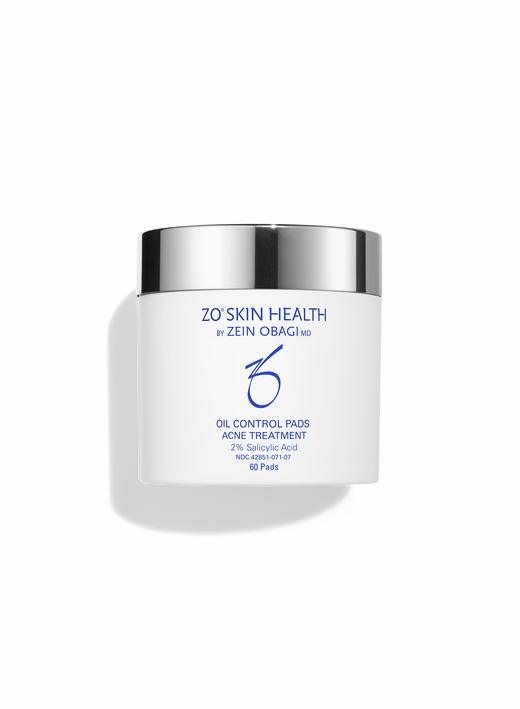 White jar of ZO Skin Health Oil Control Pads Acne Treatment with 2% Salicylic Acid, featuring a silver lid and blue branding, containing 60 pads.