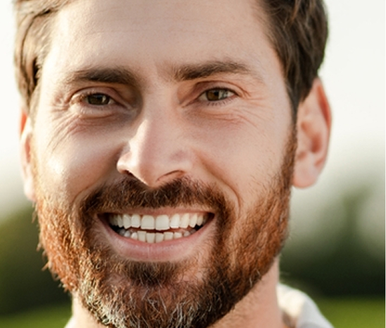 Smiling man representing hyperhidrosis treatment results